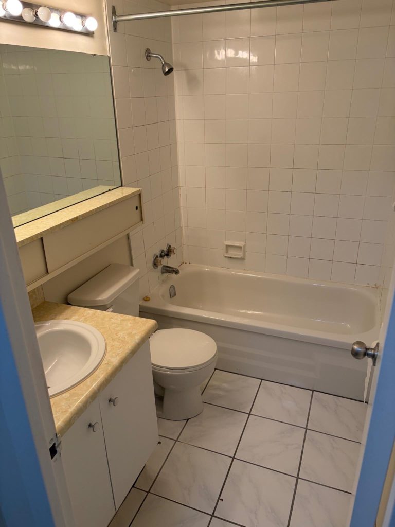Empty condo bathroom before move-in cleaning