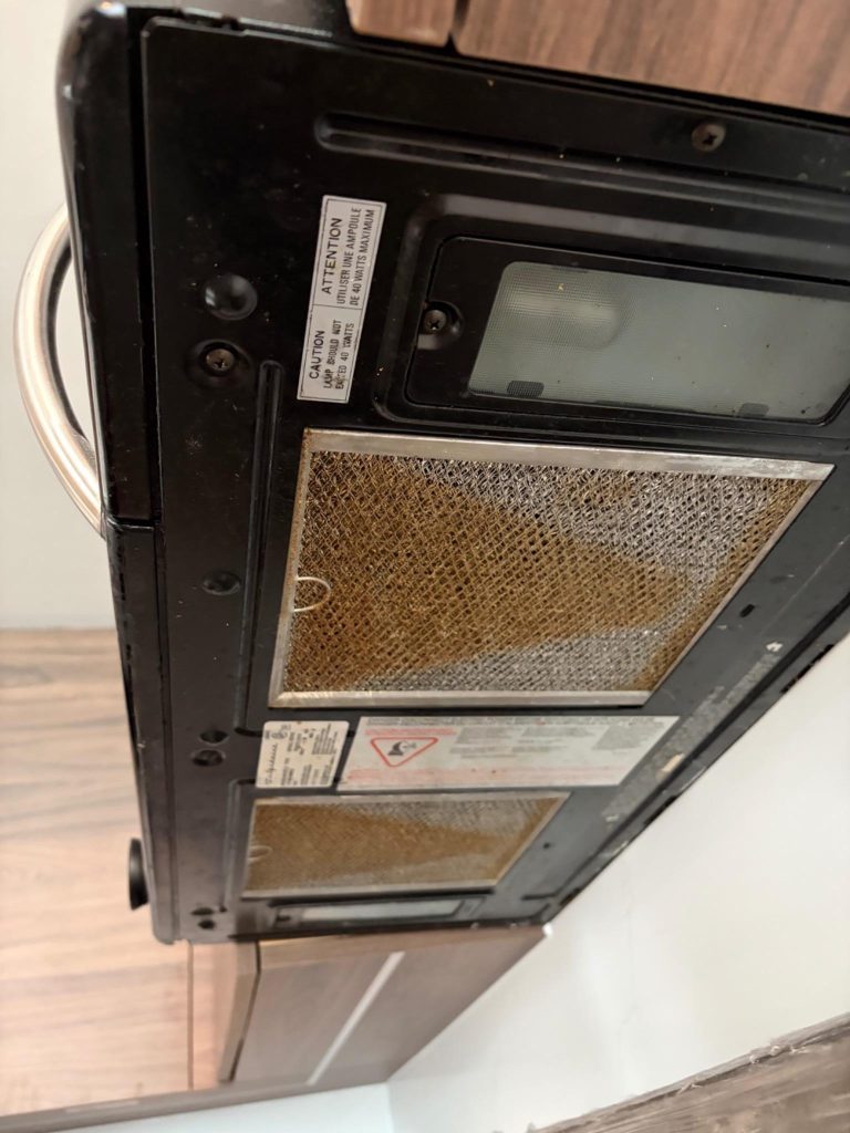Empty kitchen appliance interior before move-in cleaning